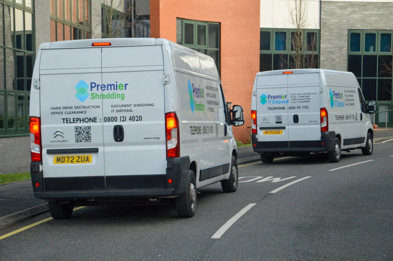 Premier Group Recycling fleet — branded Premier IT Disposal and Premier Shredding vans ready for nationwide collections